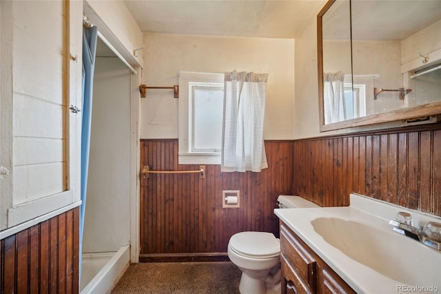 125 S Limit St, Colorado Springs, CO 80905 - full bath featuring a wainscoted wall, vanity, toilet, wooden walls, and a shower