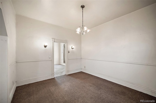 125 S Limit St, Colorado Springs, CO 80905 - spare room featuring dark carpet, a chandelier, and baseboards