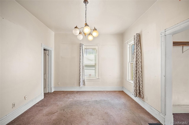 125 S Limit St, Colorado Springs, CO 80905 - unfurnished dining area featuring carpet, a chandelier, and baseboards
