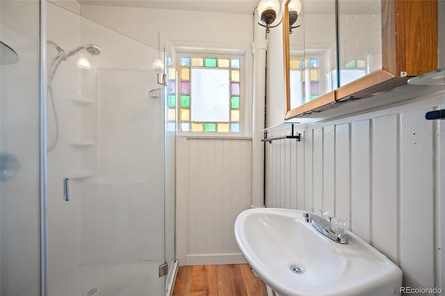 125 S Limit St, Colorado Springs, CO 80905 - full bathroom featuring a shower stall, a sink, and wood finished floors