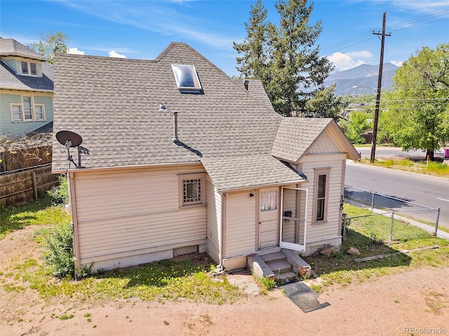 125 S Limit St, Colorado Springs, CO 80905 - view of front of home featuring a shingled roof, entry steps, and a mountain view