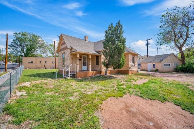 125 S Limit St, Colorado Springs, CO 80905 - view of front facade featuring a chimney and a shingled roof