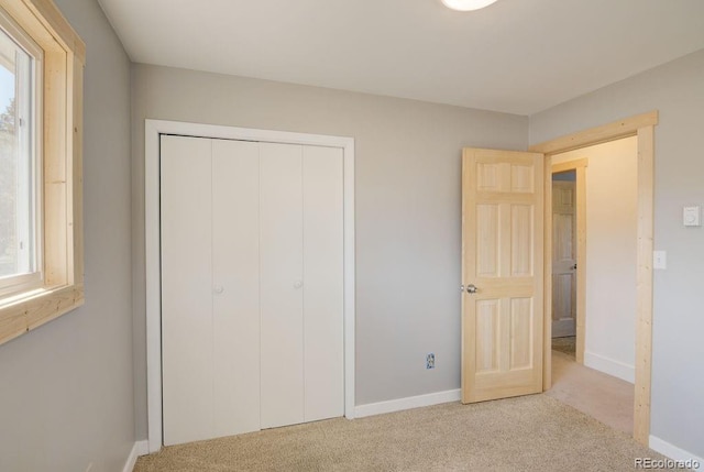 31252 County Road 384a, Buena Vista, CO 81211 - unfurnished bedroom with carpet floors, baseboards, a closet, and multiple windows