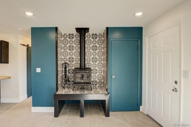 31252 County Road 384a, Buena Vista, CO 81211 - mudroom with a wood stove, a barn door, baseboards, and recessed lighting