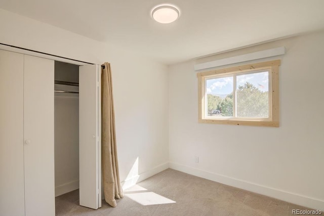 31252 County Road 384a, Buena Vista, CO 81211 - unfurnished bedroom featuring baseboards, light carpet, and a closet