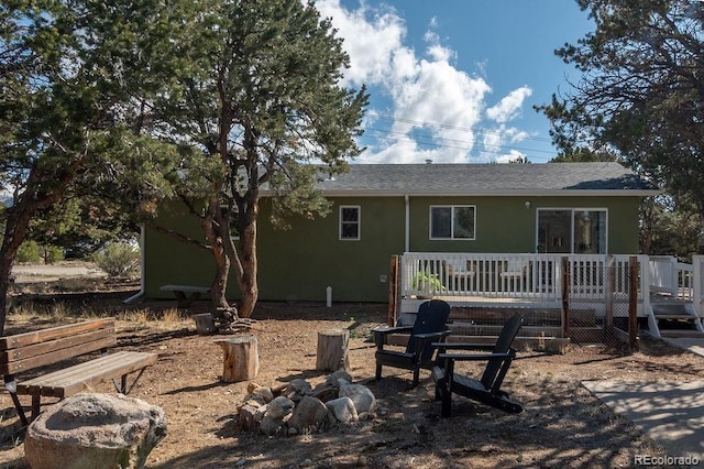 31252 County Road 384a, Buena Vista, CO 81211 - rear view of property featuring a wooden deck, stucco siding, and a shingled roof