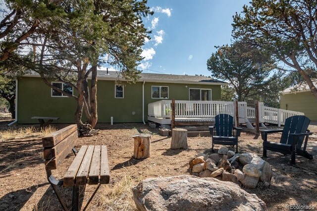 31252 County Road 384a, Buena Vista, CO 81211 - rear view of house featuring stucco siding and a wooden deck