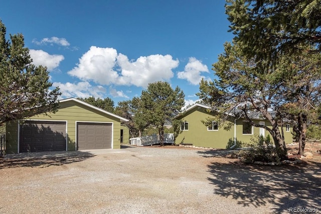 31252 County Road 384a, Buena Vista, CO 81211 - view of side of property with a detached garage, an outdoor structure, and dirt driveway
