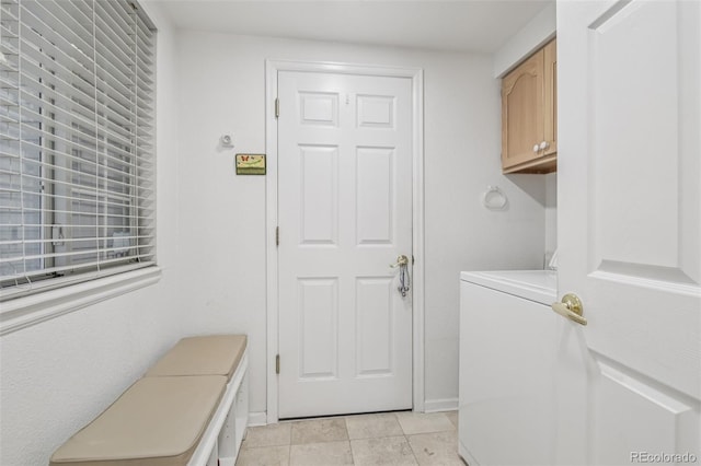 7664 S Ivanhoe Way, Centennial, CO 80112 - laundry room with washer / clothes dryer, cabinet space, and light tile patterned floors