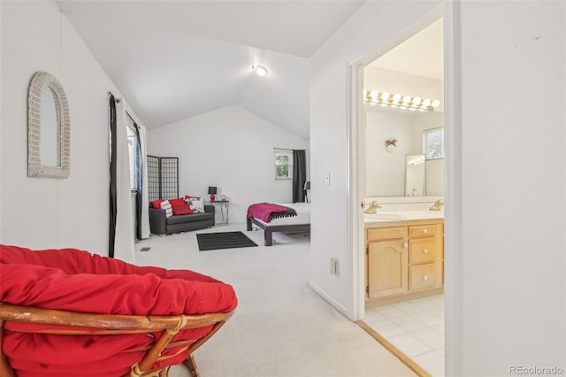 7664 S Ivanhoe Way, Centennial, CO 80112 - bedroom with light carpet, ensuite bathroom, and vaulted ceiling