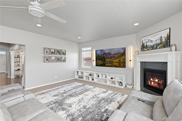 1315 Sidewinder Cir, Castle Rock, CO 80108 - carpeted living room featuring a brick fireplace, ceiling fan, baseboards, and recessed lighting
