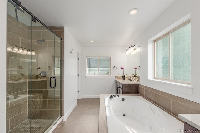 3322 W 26th Ave, Denver, CO 80211 - full bath with vanity, plenty of natural light, a whirlpool tub, a shower stall, and recessed lighting