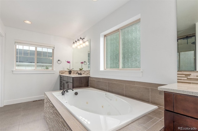 3322 W 26th Ave, Denver, CO 80211 - full bathroom with vanity, a tub with jets, baseboards, and recessed lighting