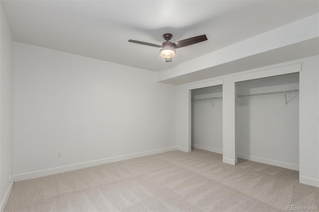 3322 W 26th Ave, Denver, CO 80211 - unfurnished bedroom with two closets, light carpet, baseboards, and a ceiling fan