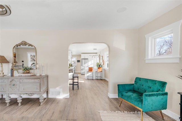 sitting room featuring light hardwood / wood-style floors