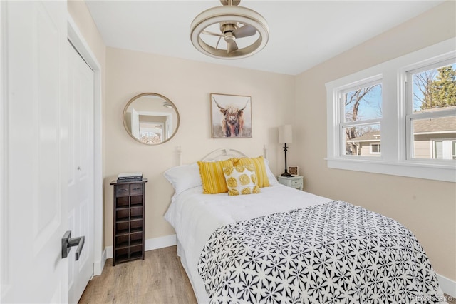 bedroom featuring a closet and light hardwood / wood-style flooring