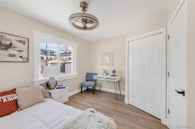 bedroom with a closet and light wood-type flooring