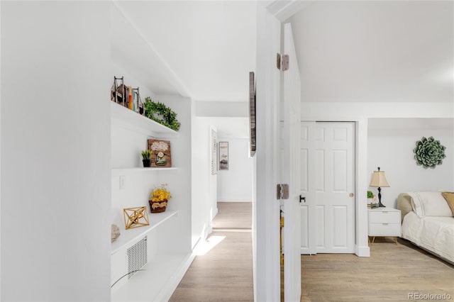 corridor featuring light wood-type flooring