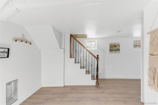 stairway featuring hardwood / wood-style floors