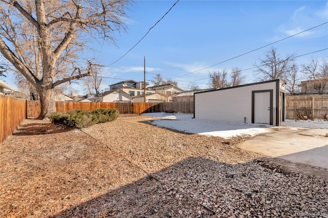 view of yard featuring a patio area and an outbuilding