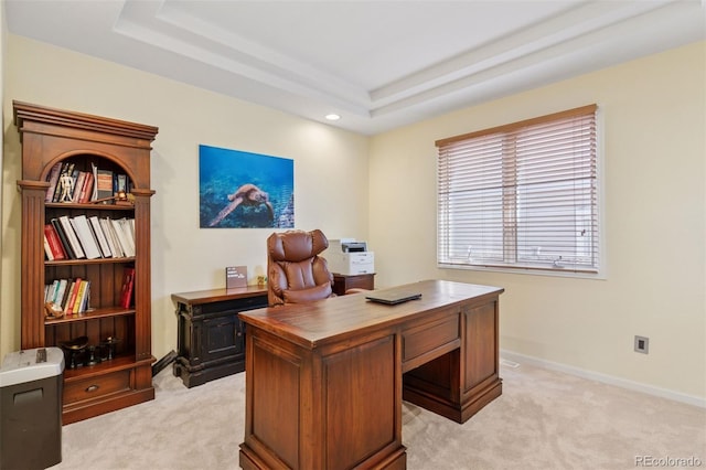 office area featuring baseboards, a tray ceiling, recessed lighting, and light colored carpet