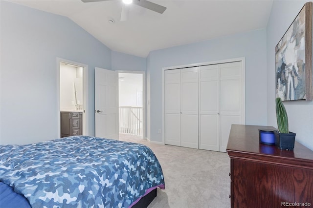 bedroom featuring vaulted ceiling, a ceiling fan, carpet flooring, and a closet