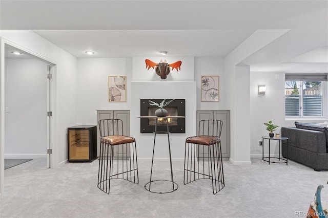 living area featuring recessed lighting, carpet flooring, and baseboards
