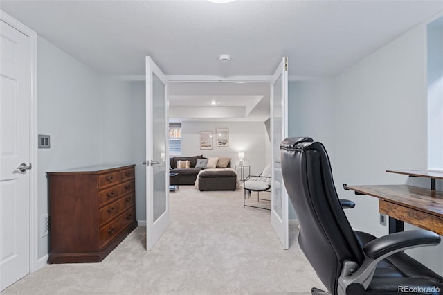 home office featuring french doors and light colored carpet