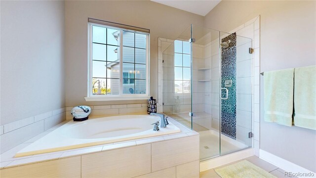 bathroom featuring separate shower and tub and tile patterned floors