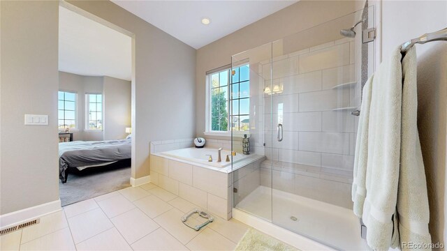 bathroom with plus walk in shower and tile patterned flooring