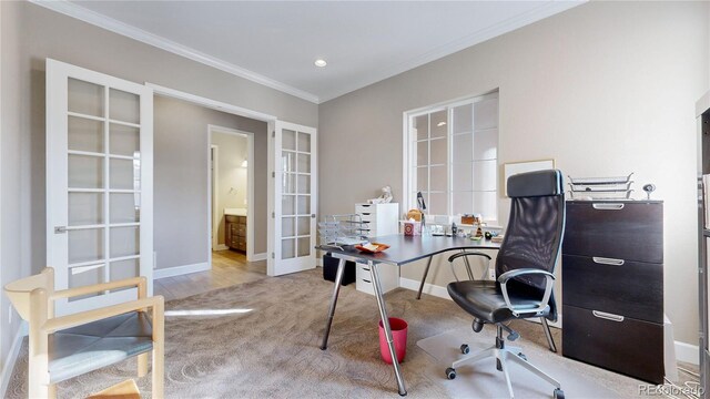 office with light wood-type flooring, french doors, and crown molding