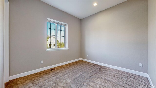 view of carpeted spare room