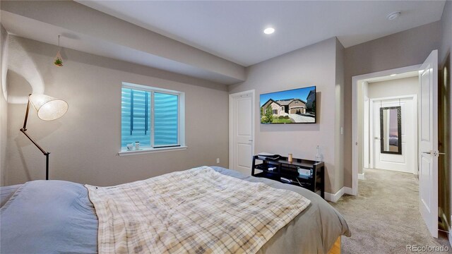 bedroom with light colored carpet