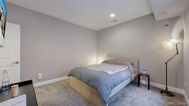 bedroom with light carpet