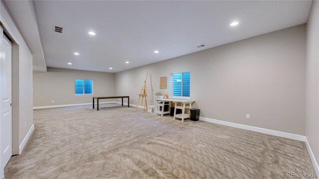 interior space featuring light colored carpet