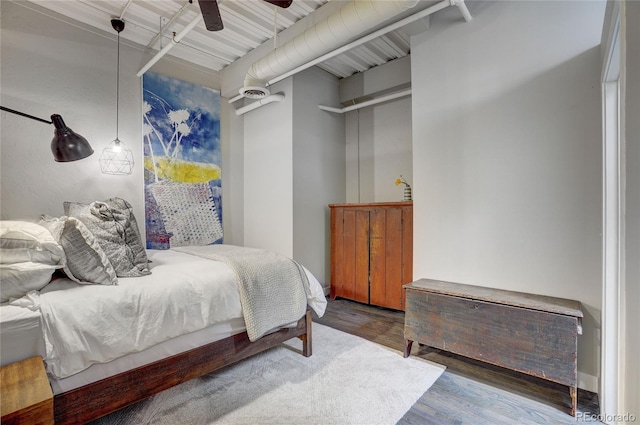 bedroom with wood finished floors and a ceiling fan