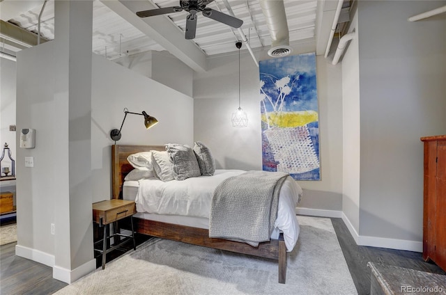 bedroom with a ceiling fan, visible vents, and baseboards