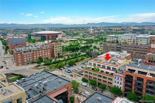 drone / aerial view with a view of city and a mountain view