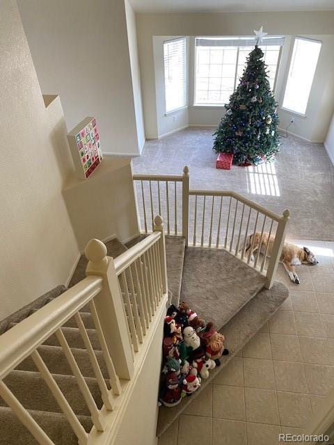 stairs with tile patterned flooring