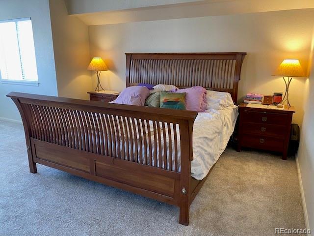 bedroom featuring light carpet