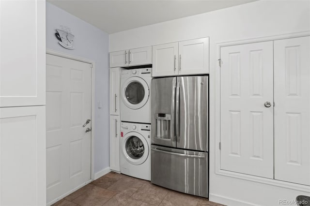 2511 S Bahama Cir Unit A, Aurora, CO 80013 - washroom featuring stacked washer and clothes dryer and baseboards