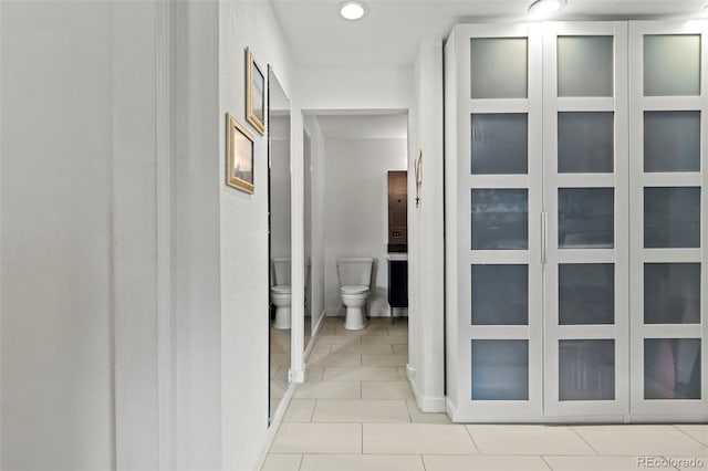 2511 S Bahama Cir Unit A, Aurora, CO 80013 - hall with light tile patterned flooring and recessed lighting