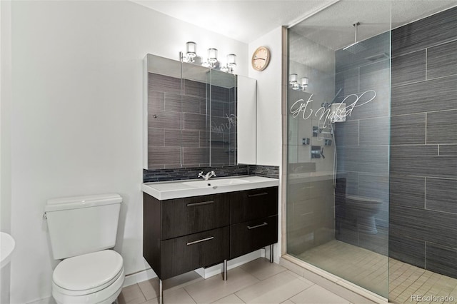 2511 S Bahama Cir Unit A, Aurora, CO 80013 - bathroom featuring tiled shower, vanity, and tile patterned flooring