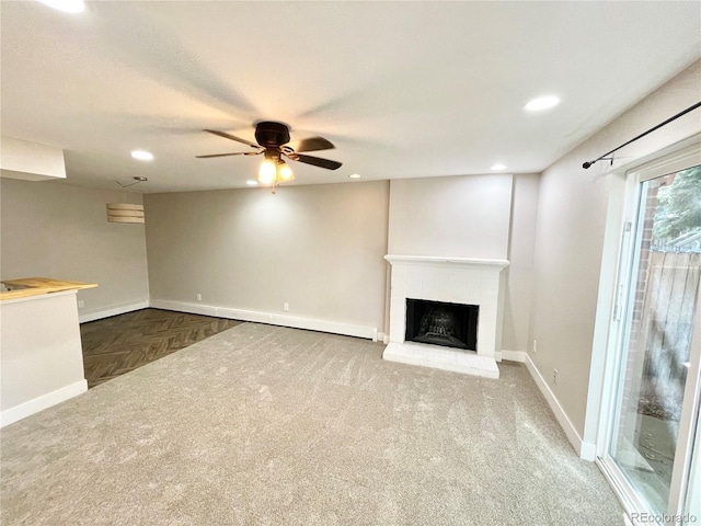 64 Nome Way Unit C, Aurora, CO 80012 - unfurnished living room with a ceiling fan, recessed lighting, a brick fireplace, baseboards, and carpet