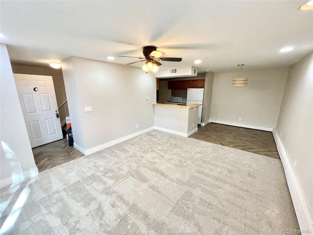 64 Nome Way Unit C, Aurora, CO 80012 - unfurnished living room featuring recessed lighting, baseboards, dark colored carpet, and a ceiling fan