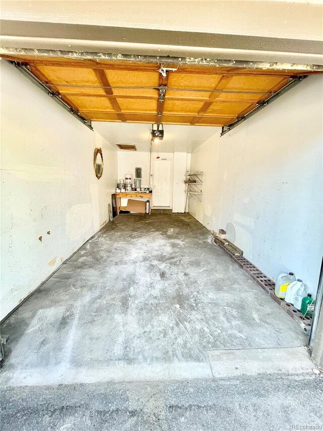 64 Nome Way Unit C, Aurora, CO 80012 - garage with a garage door opener