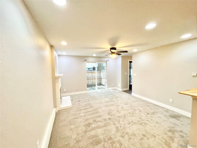 64 Nome Way Unit C, Aurora, CO 80012 - carpeted empty room with a baseboard heating unit, a ceiling fan, recessed lighting, and baseboards