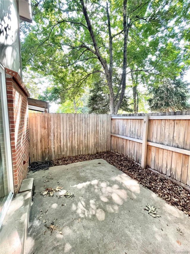 64 Nome Way Unit C, Aurora, CO 80012 - view of patio / terrace with a fenced backyard