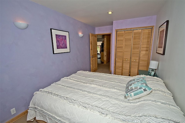 bedroom with carpet flooring and a closet