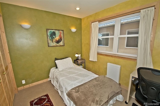 carpeted bedroom featuring radiator heating unit